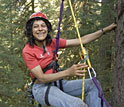Photo shows Nalini Nadkarni and ropes and pulleys she uses as a canopy researcher.