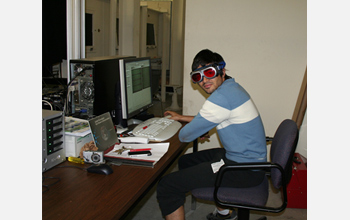 Photo of Raul Cal modeling the cool laser eye-protecting glasses used during the experiments.