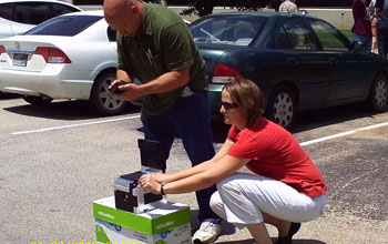 teachers with pinhole camera