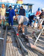 a giant "gravity core" being removed from a core barrel.