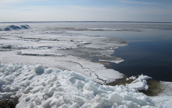 Ice-covered lakes warm faster than those with open water.