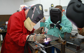 Two students learning welding skills at Weld-Ed.