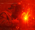 A person welding.