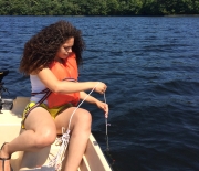 Citizen volunteers collect lake water using a deep-water sampler.