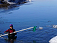 Alison Banwell wades through a meltwater lake