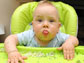 a baby sitting in a high chair