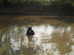 a lady in a pond