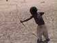 a young boy practices his archery skills