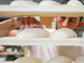 baker checking bread dough
