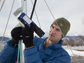 Ethan Gutmann examines a laser instrument