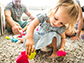 an infant playing with toys