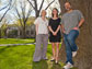 the three researcher posing outside Harvard