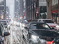 cars on a street in a snow storm