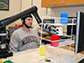 a student fitted with a specialized noninvasive brain cap