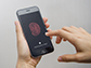 a hand scanning fingerprint on smartphone