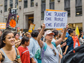 people holding signs