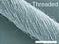 scanning electron microscopy image of nanofibers woven into threads