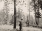 photo of a man standing in clearing