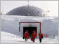 Photo of men walking into 1975 South Pole station entrance