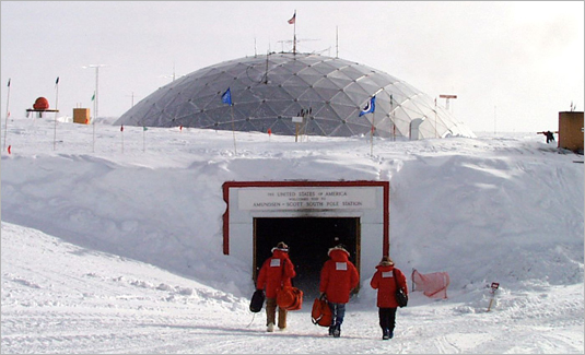 Photo of men walking into 1975 South Pole station entrance