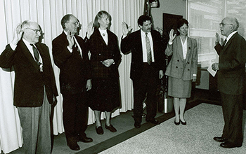 John H. Gibbons, swears in new committee members