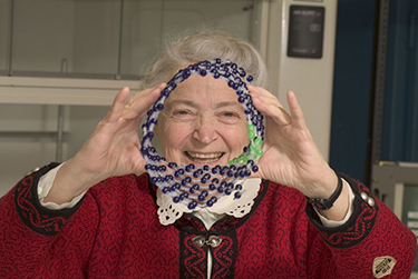 Mildred S. Dresselhaus holding a model of a carbon nanotube. Credit: Ed Quinn