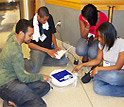 Photo of four students in a circle