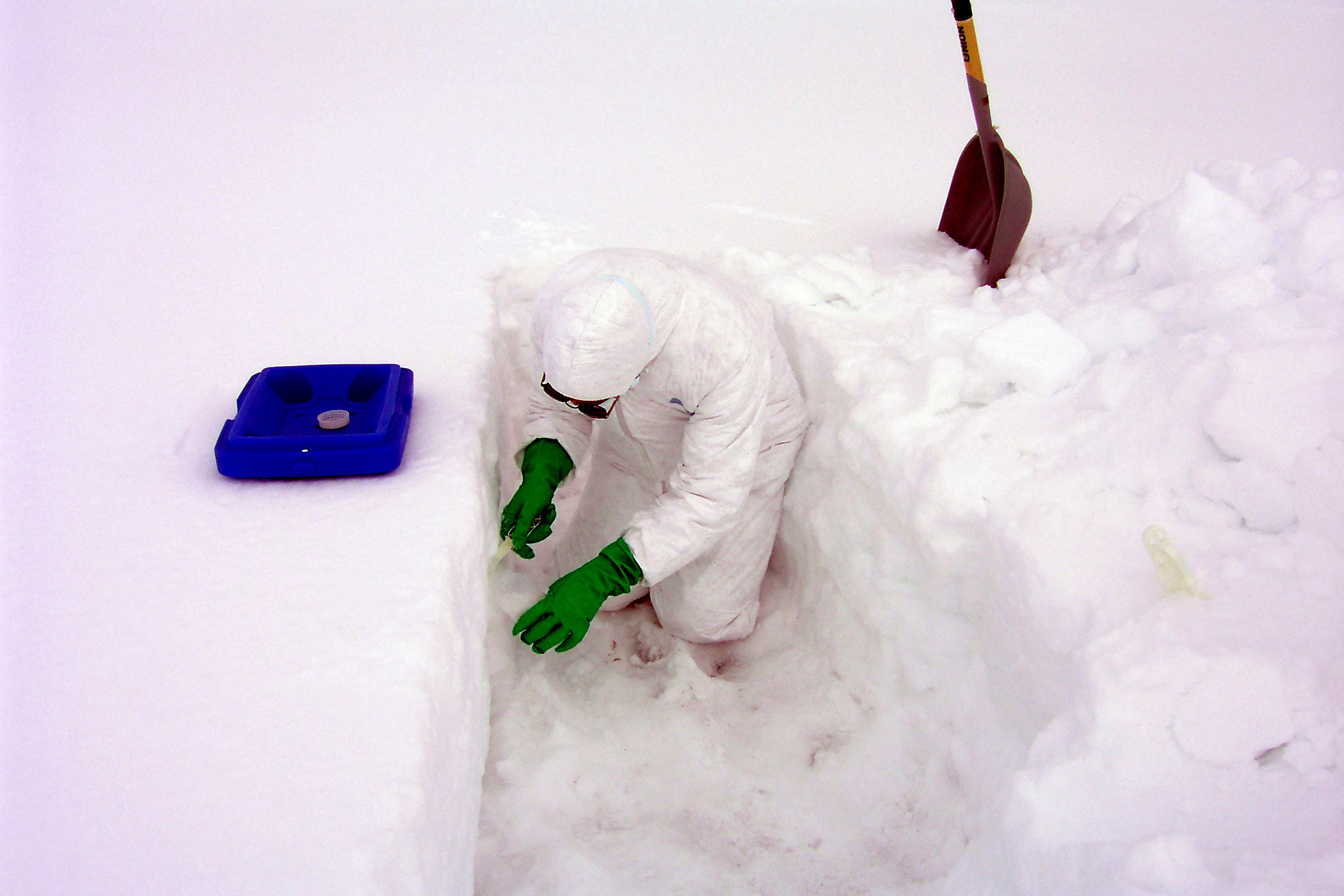 Researcher sampling snow